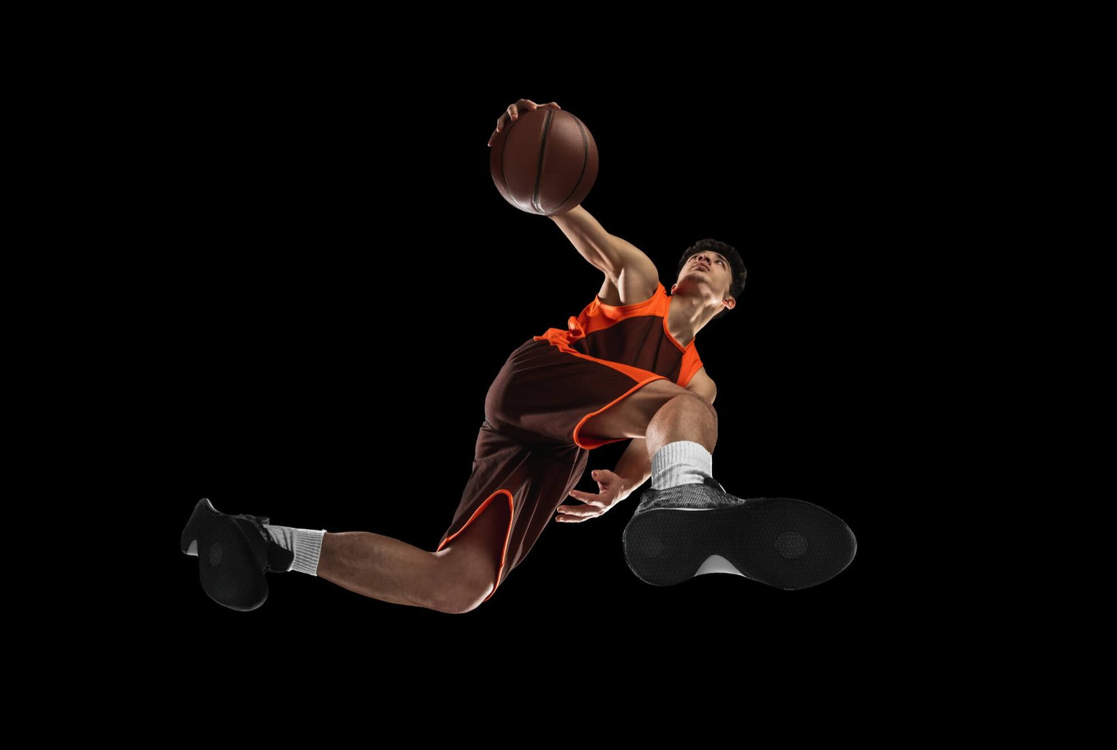 young-professional-basketball-player-action-motion-isolated-black-wall-look-from-bottom-concept-sport-movement-energy-dynamic-healthy-lifestyle-training-practicing